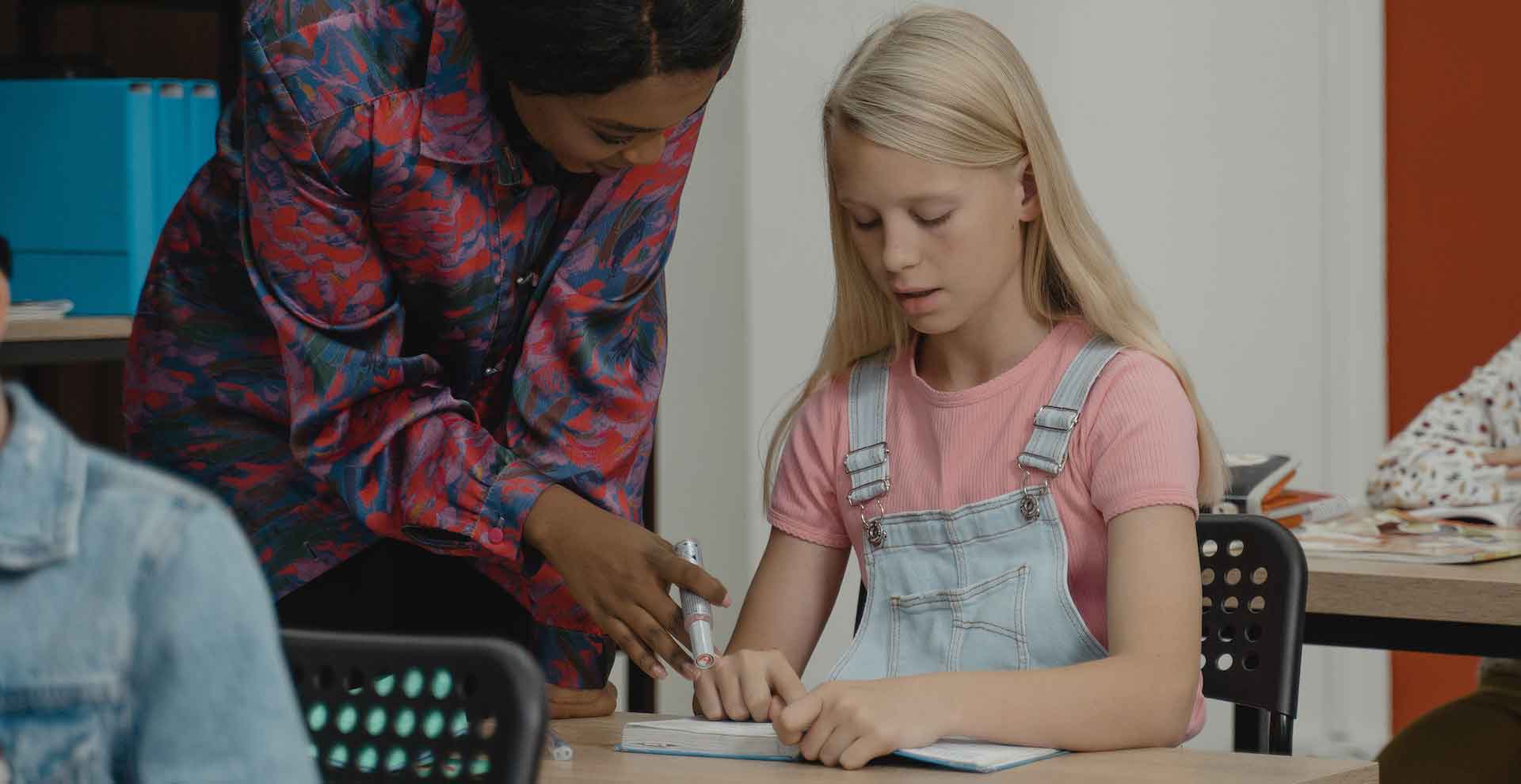 Teacher educating a student